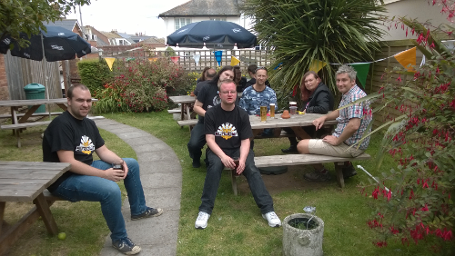 sceners chilling at The Feathers pub in Budleigh Salterton; From left to right for the front two tables: ?, SunSpire, Polynomial, Zeb, Bex, and Joey.